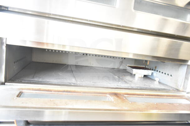 Lusi YCO-4-16D commercial propane gas 4-deck bakery/pizza oven, stainless steel, interior view, gently used.