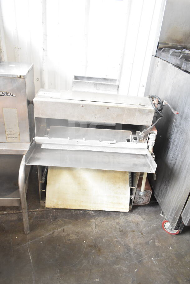 Commercial countertop dough sheeter, 115V, 1 phase. Stainless steel, used condition, visible controls and roller mechanism.
