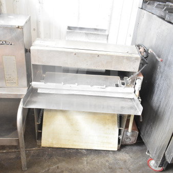 Commercial countertop dough sheeter, 115V, 1 phase. Stainless steel, used condition, visible controls and roller mechanism.