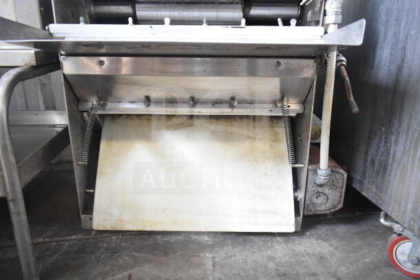 Commercial countertop dough sheeter, 115 volts, 1 phase, stainless steel, used condition, suitable for bakery use.