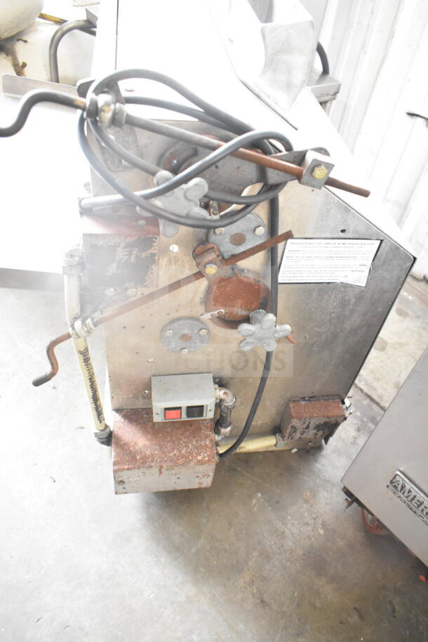 Commercial countertop dough sheeter, 115 volts, 1 phase, metal body, visible cords, minor rust on base.