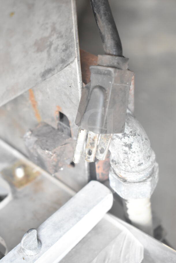 Commercial countertop dough sheeter plug detail, showing 115V, 1-phase power connection with visible wear on metal parts.