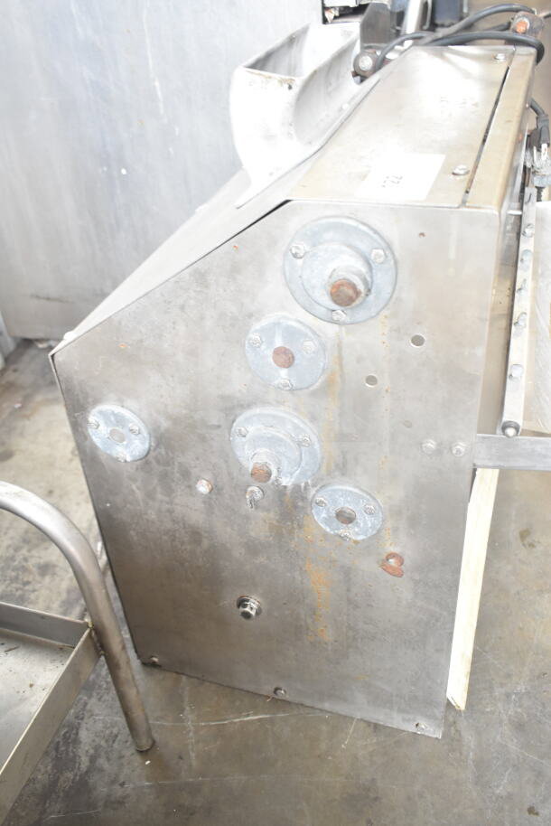 Commercial countertop dough sheeter with stainless steel finish, 115 volts, 1 phase, showing surface wear and industrial details.