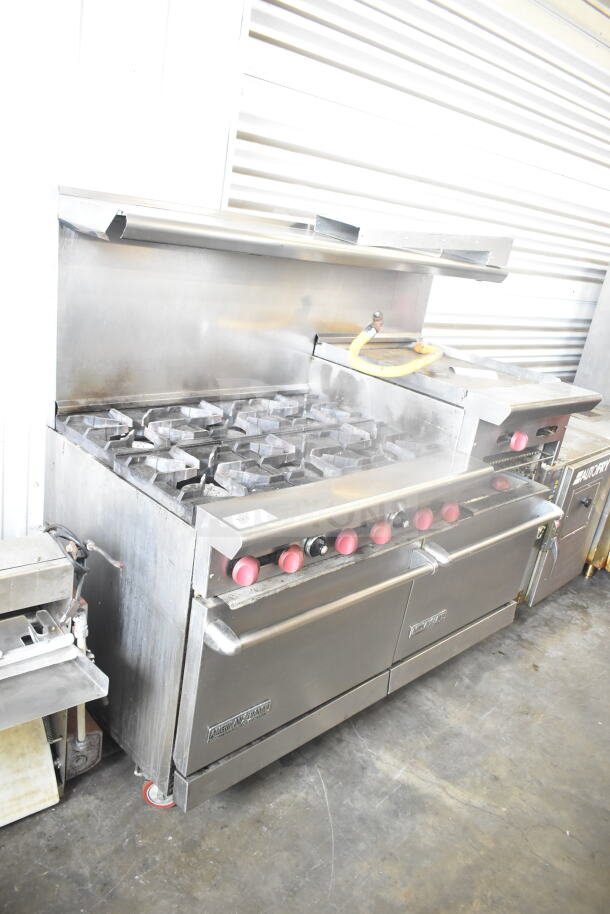 American Range commercial gas 6-burner range with flat top griddle, 2 ovens, backsplash, and overshelf; used condition.