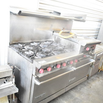 American Range commercial gas 6-burner range with flat top griddle, 2 ovens, backsplash, and overshelf; used condition.