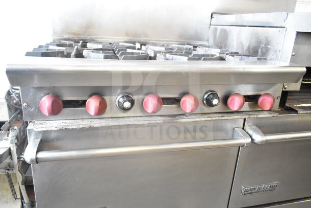 American Range commercial 6 burner gas range, flat top griddle, dual ovens, backsplash, overshelf, fair condition.