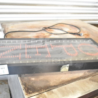 Open light-up sign with red LED lights, black frame. Visible power cord and mounting chain. Auction tag with number 126.