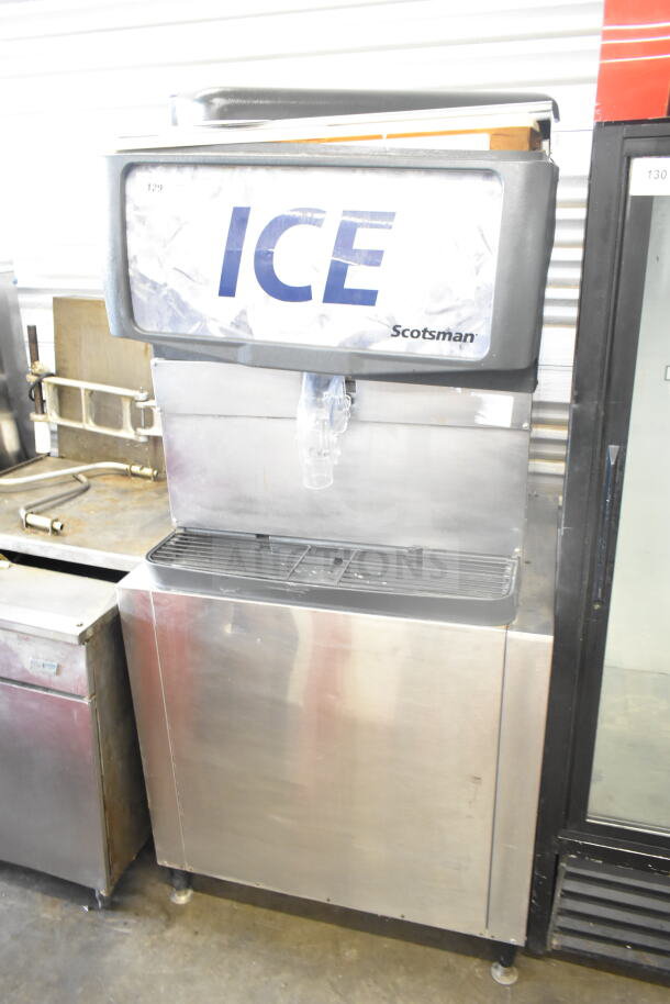 Scotsman Commercial Ice Dispenser, stainless steel, 115 volts, 1 phase, used condition. Marked "ICE" and "Scotsman."