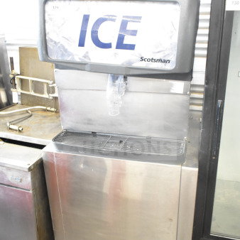 Scotsman Commercial Ice Dispenser, stainless steel, 115 volts, 1 phase, used condition. Marked "ICE" and "Scotsman."
