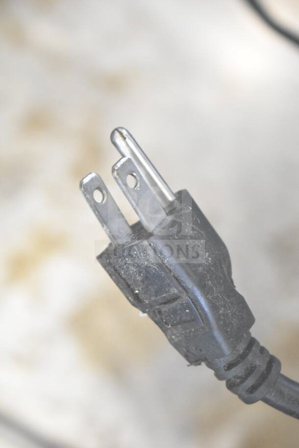 Scotsman Commercial Ice Dispenser power plug. 115 Volts, 1 Phase. Close-up of three-prong plug in used condition.
