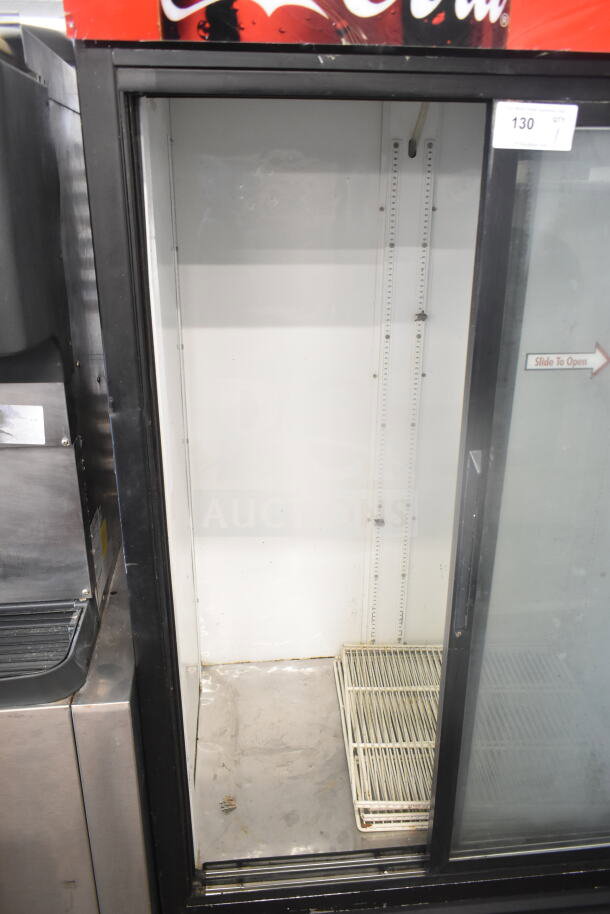 True GDM-37 Commercial 2 Door Cooler Merchandiser, glass doors, white interior, 115V, 1 Phase, visible wear.