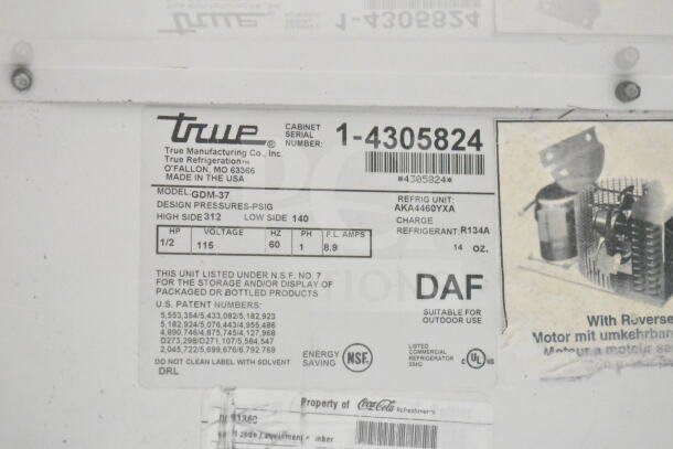 True GDM-37 cooler label showing model, serial number 1-4305824, 115V, refrigerant R134A, and NSF certification.