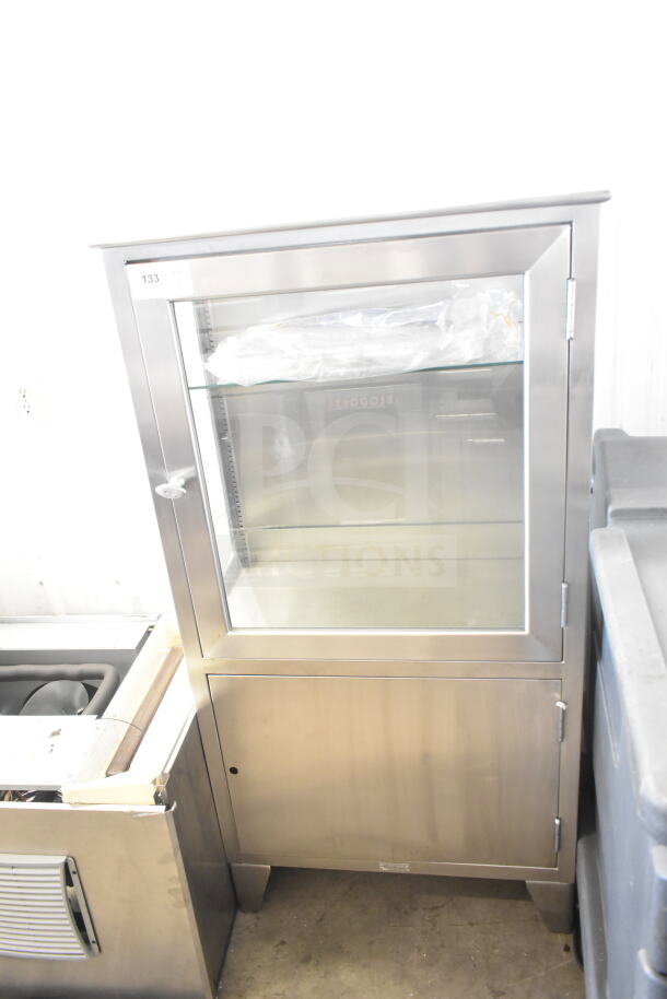 Shampaine Commercial Merchandising Cabinet, stainless steel, glass door, excellent condition, shelf inside, label number 133.