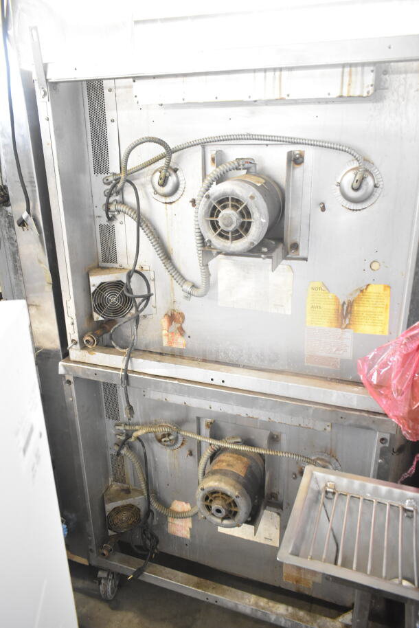 Blodgett gas-powered convection oven back with visible wiring, motors, and labels. Used condition, full-size with view-through doors.
