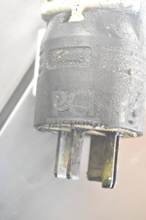 Close-up of the BKI TE101R Combi Convection Oven plug, showing wear and functionality features for AC power connection.
