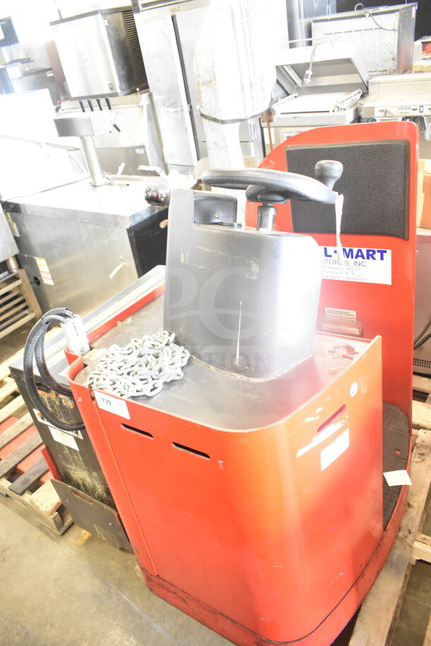 Raymond Deka 19-F60L Forklift, red, without forks, includes battery, visible labels, and control handle.