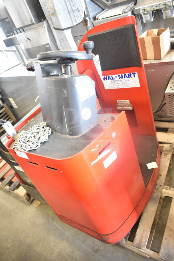 Raymond Deka 19-F60L forklift, red, no forks, includes battery, minor wear, Walmart label visible, auction item.