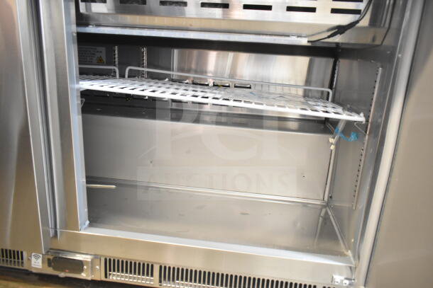 Brand new Avantco 178ZPT60MHC commercial sandwich prep table, stainless steel interior, visible shelf, 115V, 1 phase.