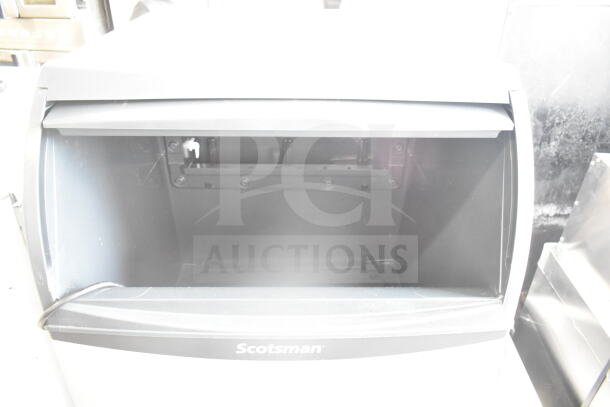 Brand new 2026 Scotsman UC2024MAX-1A ice machine, 80 lb. bin, 227 lb./day, 115V, 1 phase, minor scratches, visible Scotsman logo.