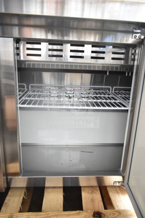 Brand new Avantco 178APT71MHC sandwich prep table with open door, revealing shelves, minor scratches visible.