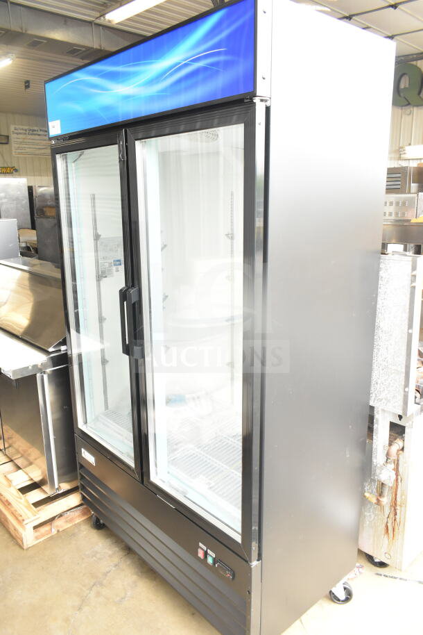 Brand new 2025 Avantco 178GDC40HCB commercial glass door refrigerator, black, with LED lighting, 115V, visible scratch and dent.