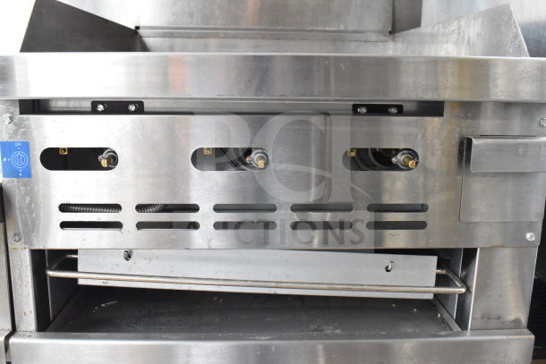 PrecisionHD Commercial Gas Range with 6 Burners, Flat Top Griddle, 2 Ovens, Shelves, Back Splash, on Casters.