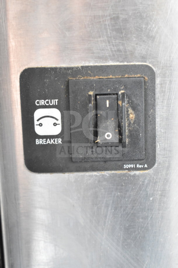 Blodgett commercial convection oven with view-through and solid doors, thermostatic controls, metal legs, and casters.