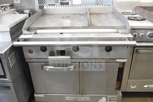 Southbend commercial gas flat top griddle with convection oven, on casters. Features control knobs and stainless finish. Used condition.