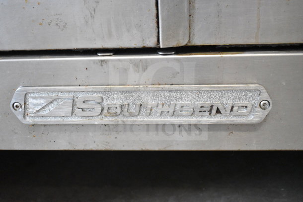Southbend commercial gas flat top griddle with convection oven on commercial casters. Metal surface shows moderate wear.
