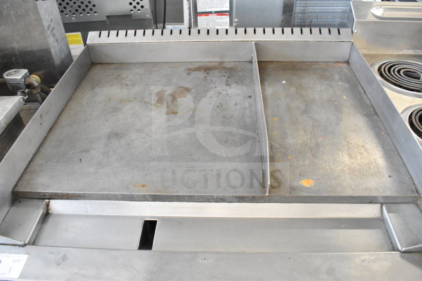 Southbend commercial gas-powered flat top griddle with convection oven, on casters. Visible wear indicates prior use.