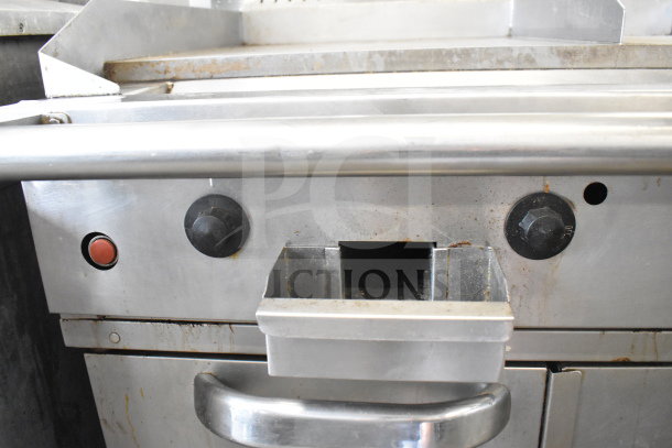 Southbend commercial gas flat top griddle with convection oven and casters, showing control knobs and handle. Used condition.
