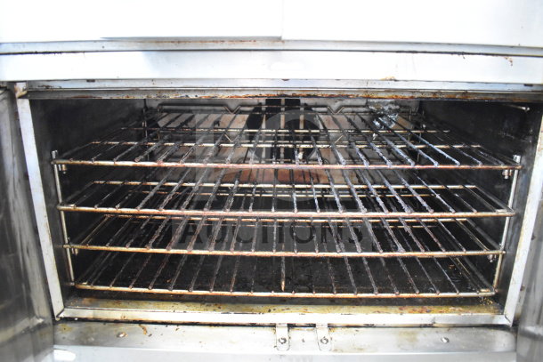 Southbend commercial gas flat top griddle and convection oven on casters, used condition, interior racks visible.