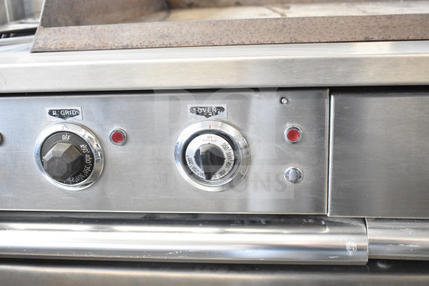 Garland commercial flat top griddle with 2 burners and oven, stainless steel, control dials labeled "R. GRID" and "OVEN".