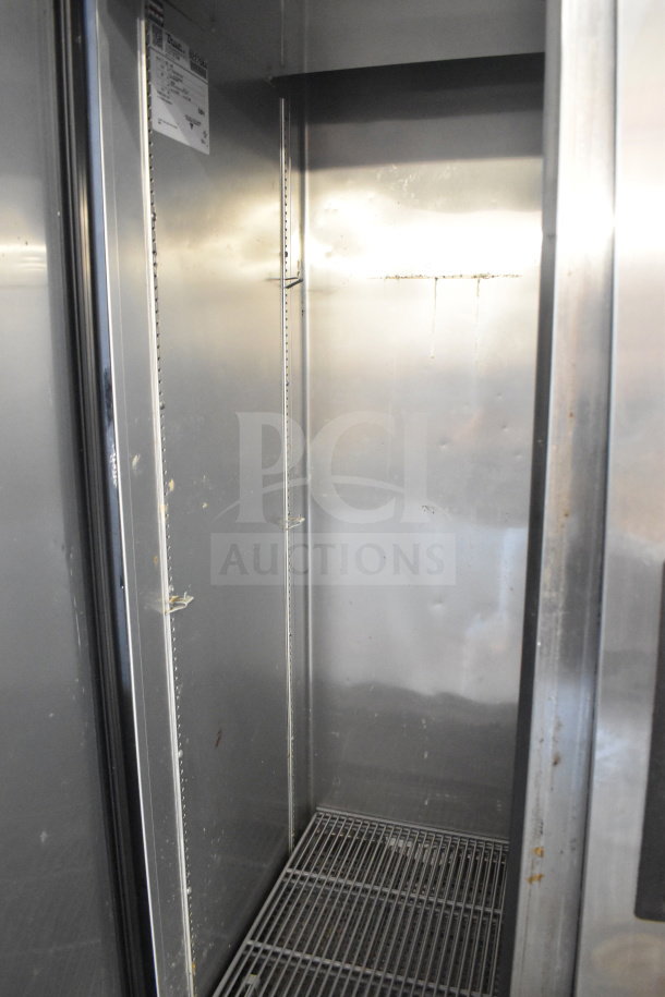 2018 True T-35-HC commercial 2-door cooler with interior shelving, stainless steel finish, on casters, 115V, 1 phase.