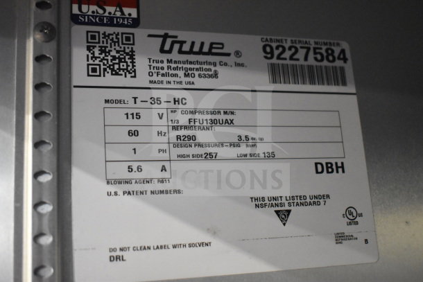 2018 True T-35-HC cooler badge with model and voltage details, 115V, 1-phase, R290 refrigerant, on commercial casters.
