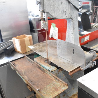 Butcher Boy Commercial Floor Meat Saw, metal construction, visible rust and wear, includes blade, model markings.