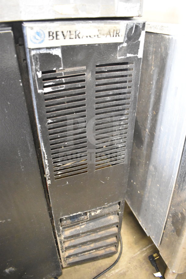 Beverage Air DD48HC-1-B-138 kegerator with 4 tap tower, black exterior, visible wear, 115 volts, 1 phase, commercial use.
