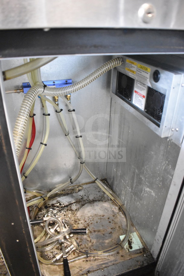 Beverage Air DD48HC-1-B-138 kegerator interior showing tubing connections and metal surfaces.
