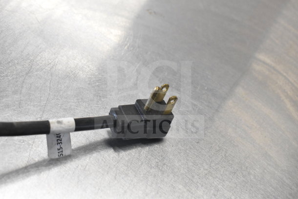 Close-up of electrical plug for Beverage Air DD48HC-1-B-138 kegerator, 115 volts, with visible tag showing “515-324”.