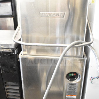 Hobart AM15 commercial dishwasher, corner pass-through, stainless steel, used condition, 208-240V, 3-phase.