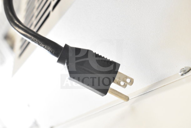 Johnson Controls Isoclean CM commercial air filter plug, 120 volts, 1 phase, shown with power cord against unit.