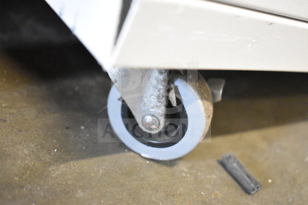 Johnson Controls Isoclean CM air filter, shown on commercial caster wheels, indicating ease of mobility. 120V, 1 Phase.