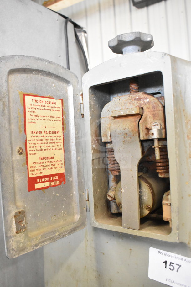 US Berkel commercial meat saw, floor style, 208 volts, 3 phase. Visible label shows tension control instructions, blade size adjustable.