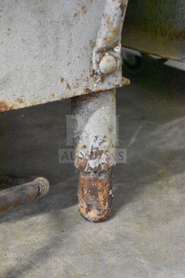 US Berkel commercial meat saw leg, showing rust and wear; 208 volts, 3-phase power; requires refurbishment.