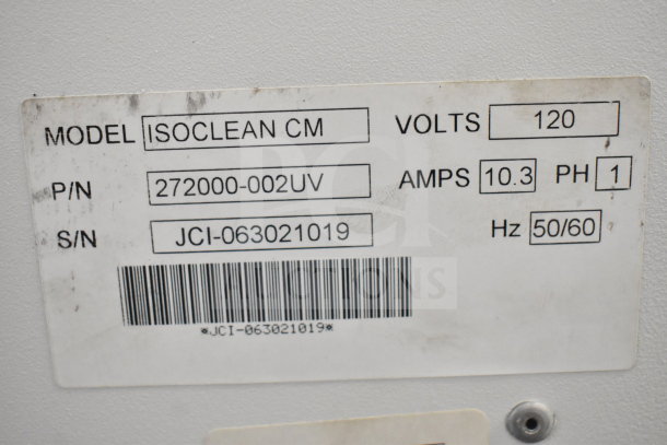 Johnson Controls Isoclean CM air filter label showing model, voltage 120, phase 1, and part/serial numbers.
