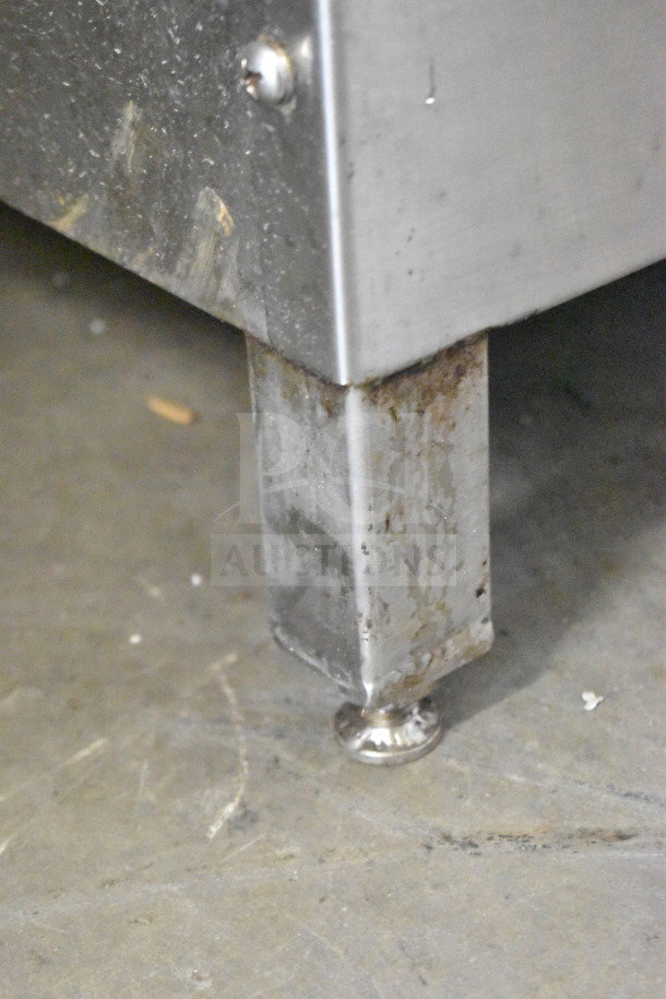 CG58 Commercial Floor Meat Mixer leg, model CG58, stainless steel, 230V, 3-phase, showing some wear and rust.