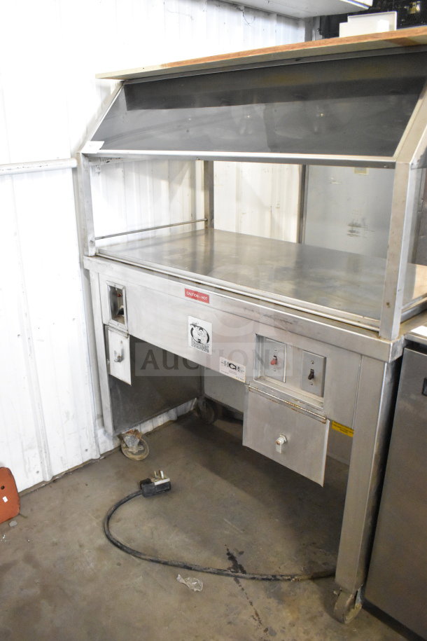 HCH Commercial Heated Buffet with stainless steel body and commercial casters. Features control panel and "Caution Hot" label.