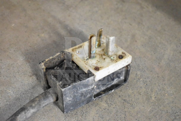 HCH Commercial Heated Buffet plug, showing wear and discoloration. Suitable for heavy-duty use with commercial casters.