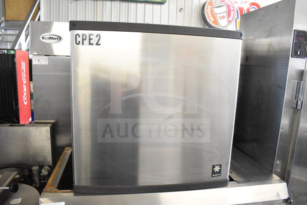 Manitowoc QD1002A ice machine on MGR SP-800-SS bin. Stainless steel, 208-230V, 1 phase. "CPE2" label visible.