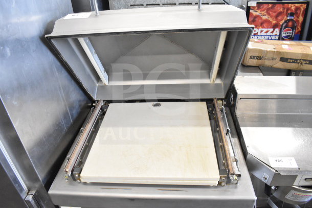 Berkel 400-A commercial vacuum sealer on casters, 208 volts, 3 phase. Open lid view showing sealing chamber, used condition.